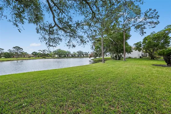 a view of a lake with houses in background