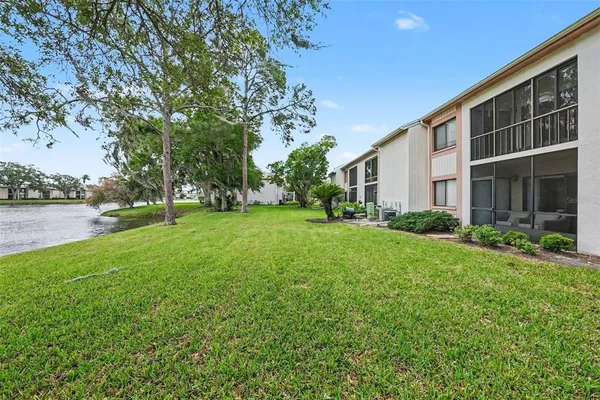 a view of a house with backyard and garden