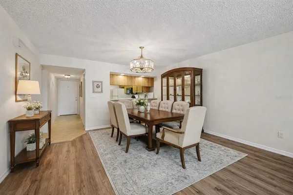a view of a dining room with furniture and wooden floor