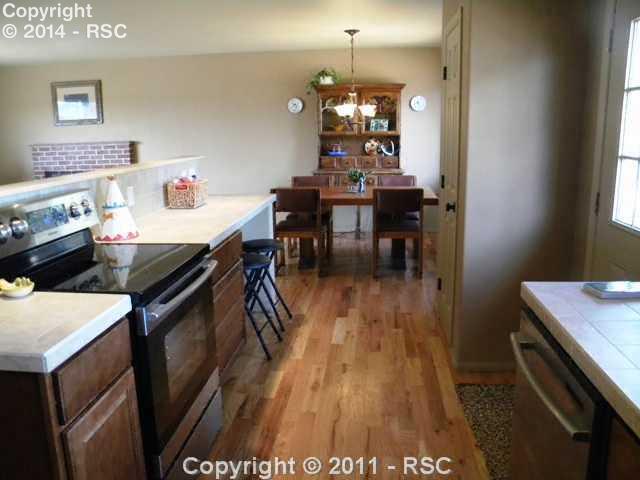 17075 Goshawk Road Colorado Springs, CO 80908 - Photo 5 of 16 Open, Bright and Cheerful