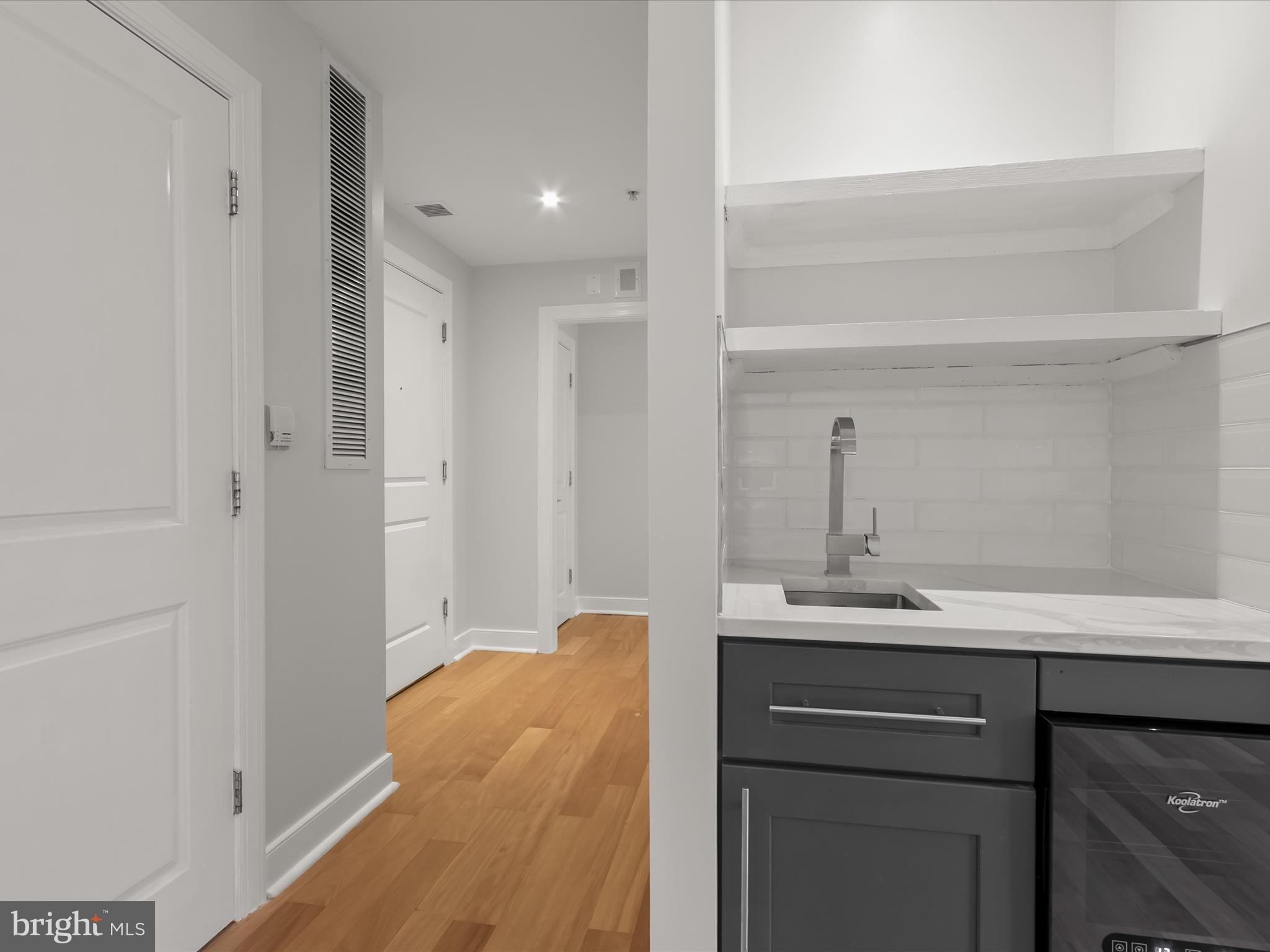 2425 L Street Northwest, Unit 239 Washington, DC 20037 - Photo 12 of 43 a bathroom with a sink and a mirror