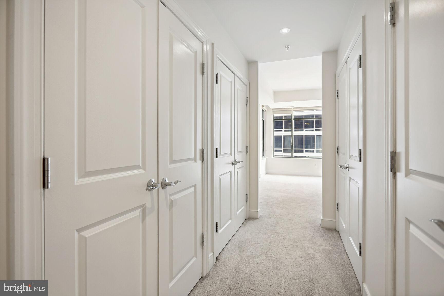 2425 L Street Northwest, Unit 239 Washington, DC 20037 - Photo 18 of 43 a view of a hallway with closet and front door