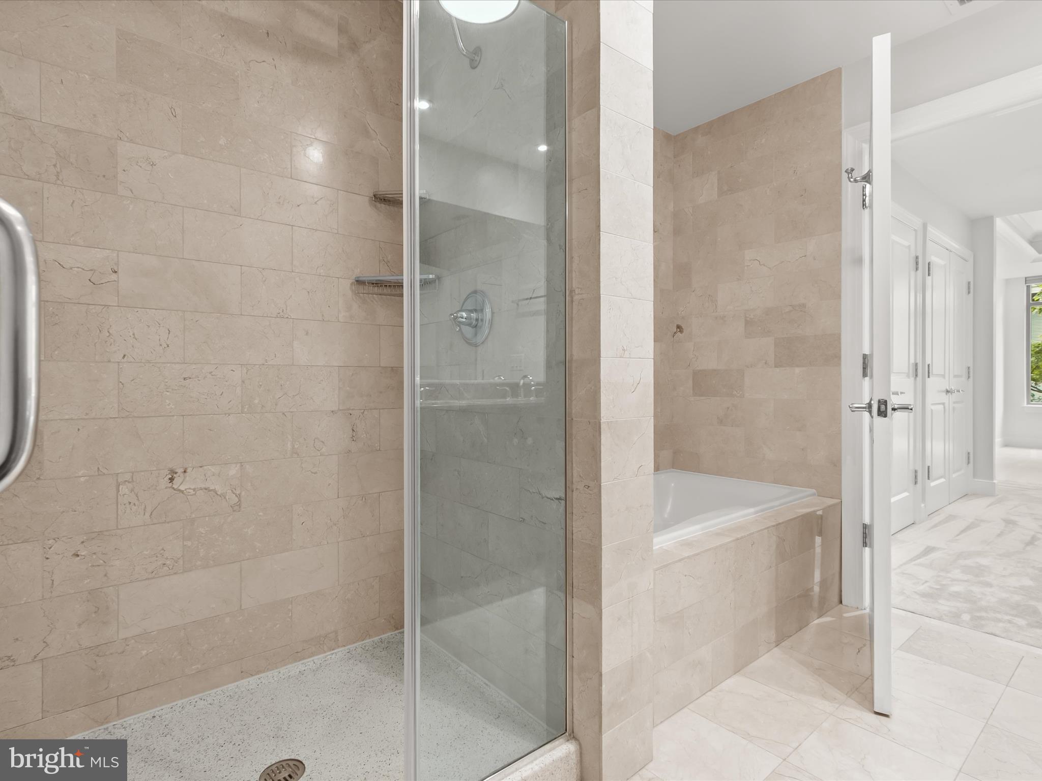 2425 L Street Northwest, Unit 239 Washington, DC 20037 - Photo 22 of 43 a bathroom with a shower and bathtub