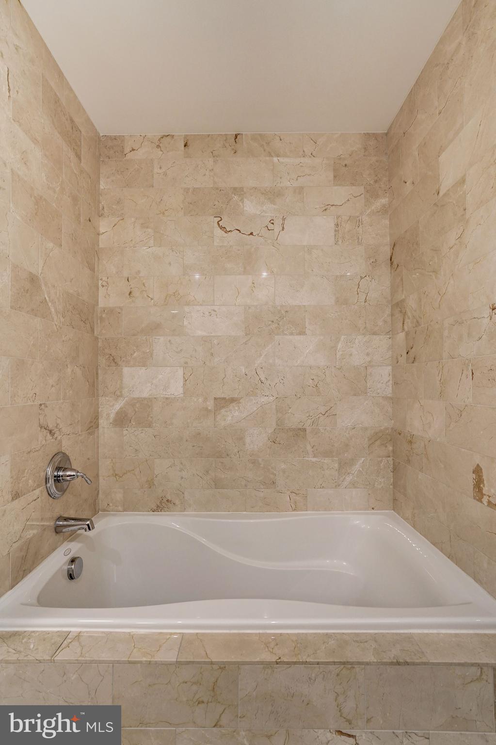 2425 L Street Northwest, Unit 239 Washington, DC 20037 - Photo 23 of 43 a bathroom with a bathtub