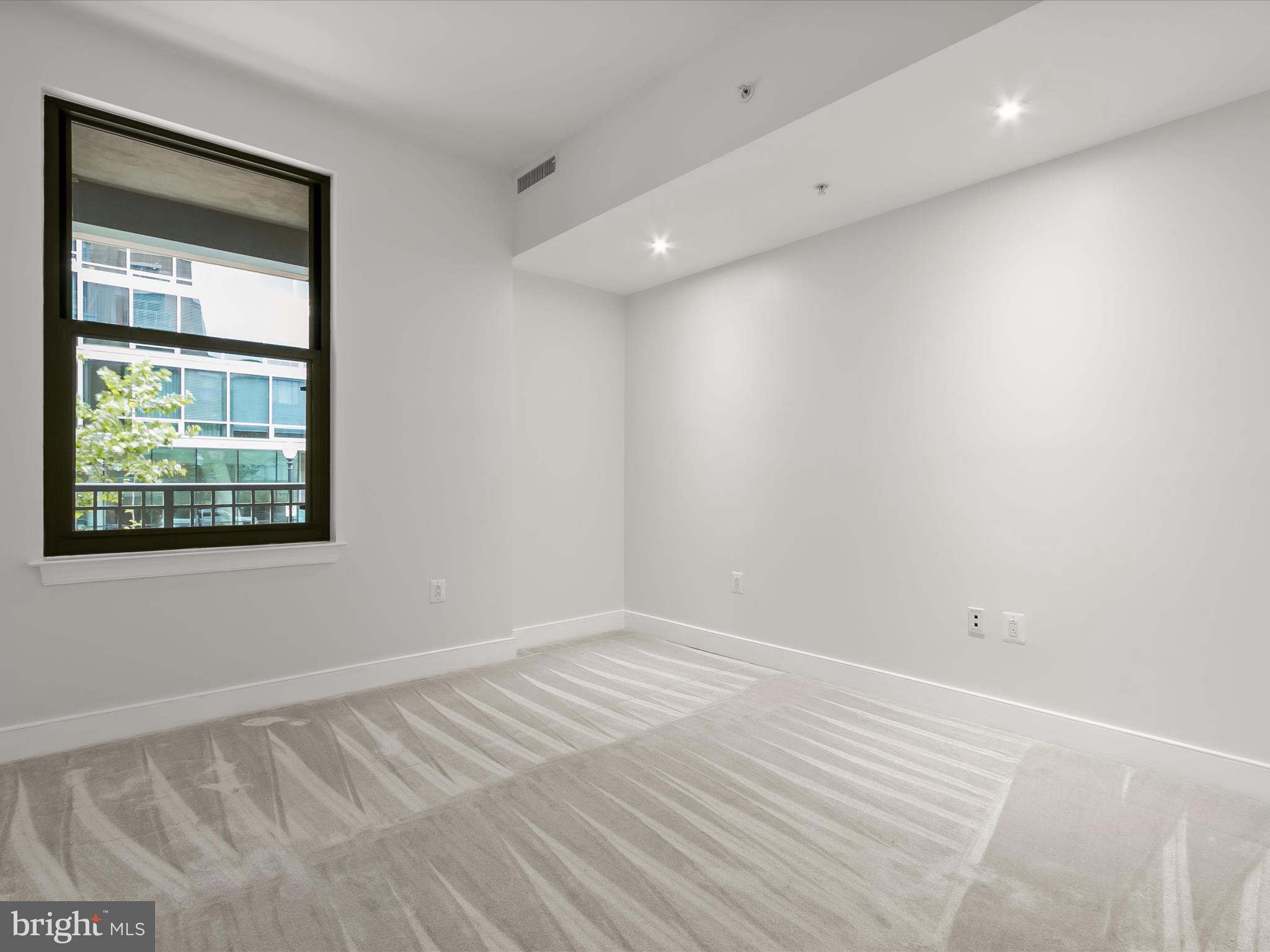 2425 L Street Northwest, Unit 239 Washington, DC 20037 - Photo 27 of 43 a view of an empty room with a window