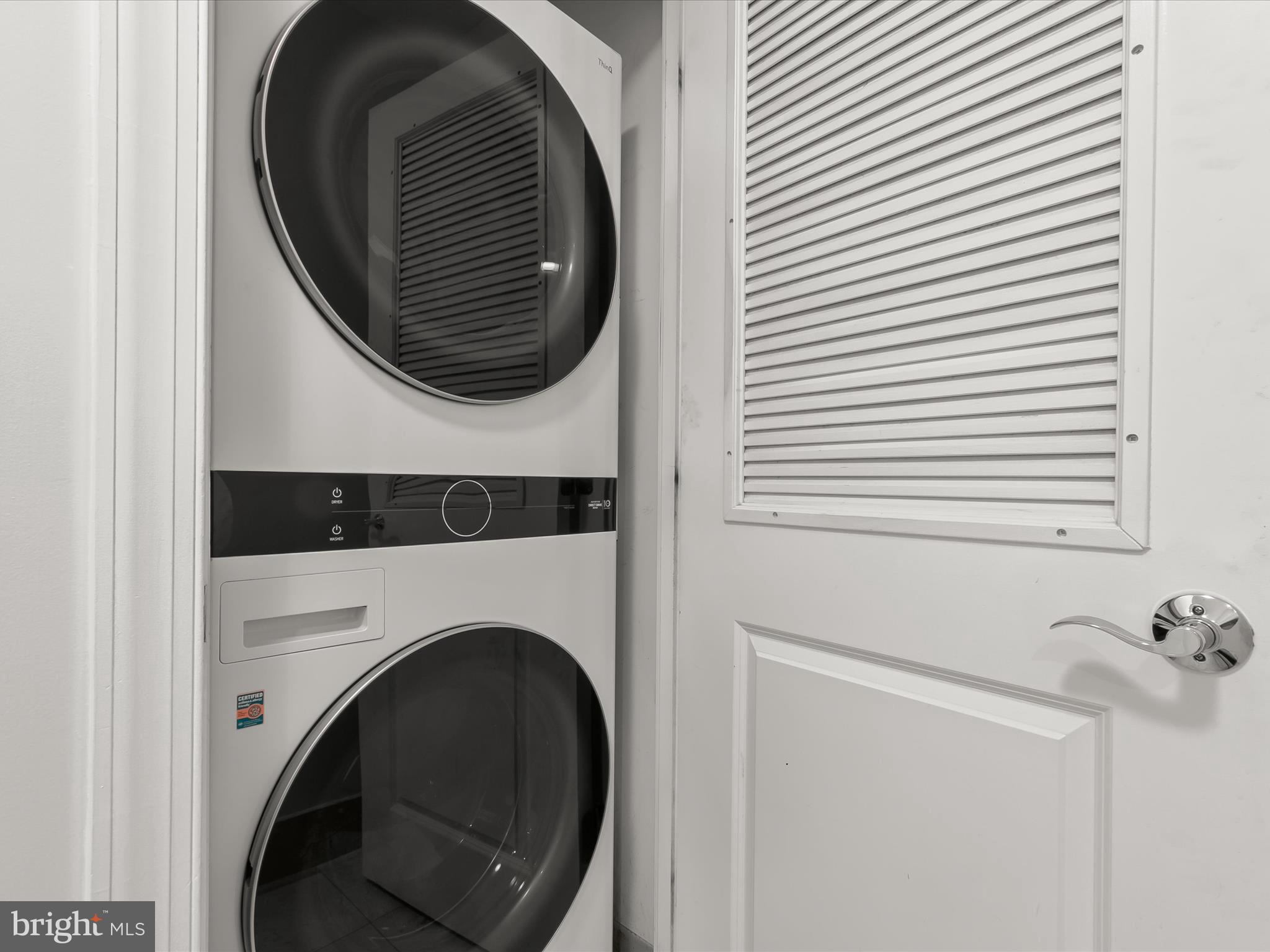2425 L Street Northwest, Unit 239 Washington, DC 20037 - Photo 32 of 43 a utility room with dryer and washer