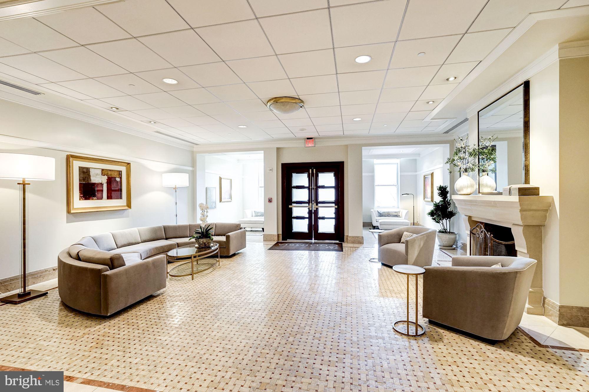 2425 L Street Northwest, Unit 239 Washington, DC 20037 - Photo 43 of 43 a living room with furniture and a flat screen tv
