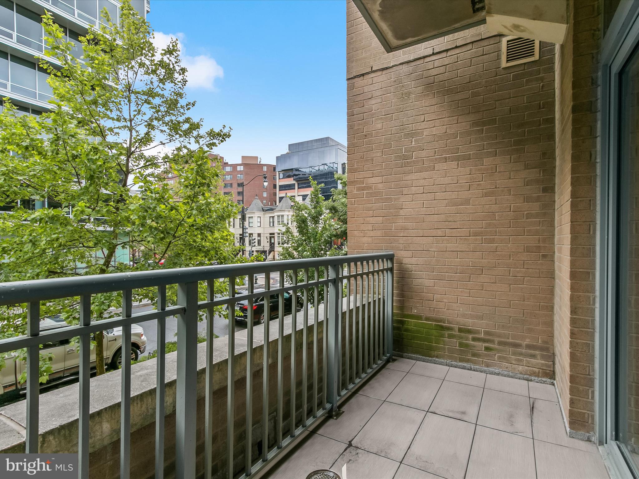 2425 L Street Northwest, Unit 239 Washington, DC 20037 - Photo 8 of 43 a view of a balcony with a small yard