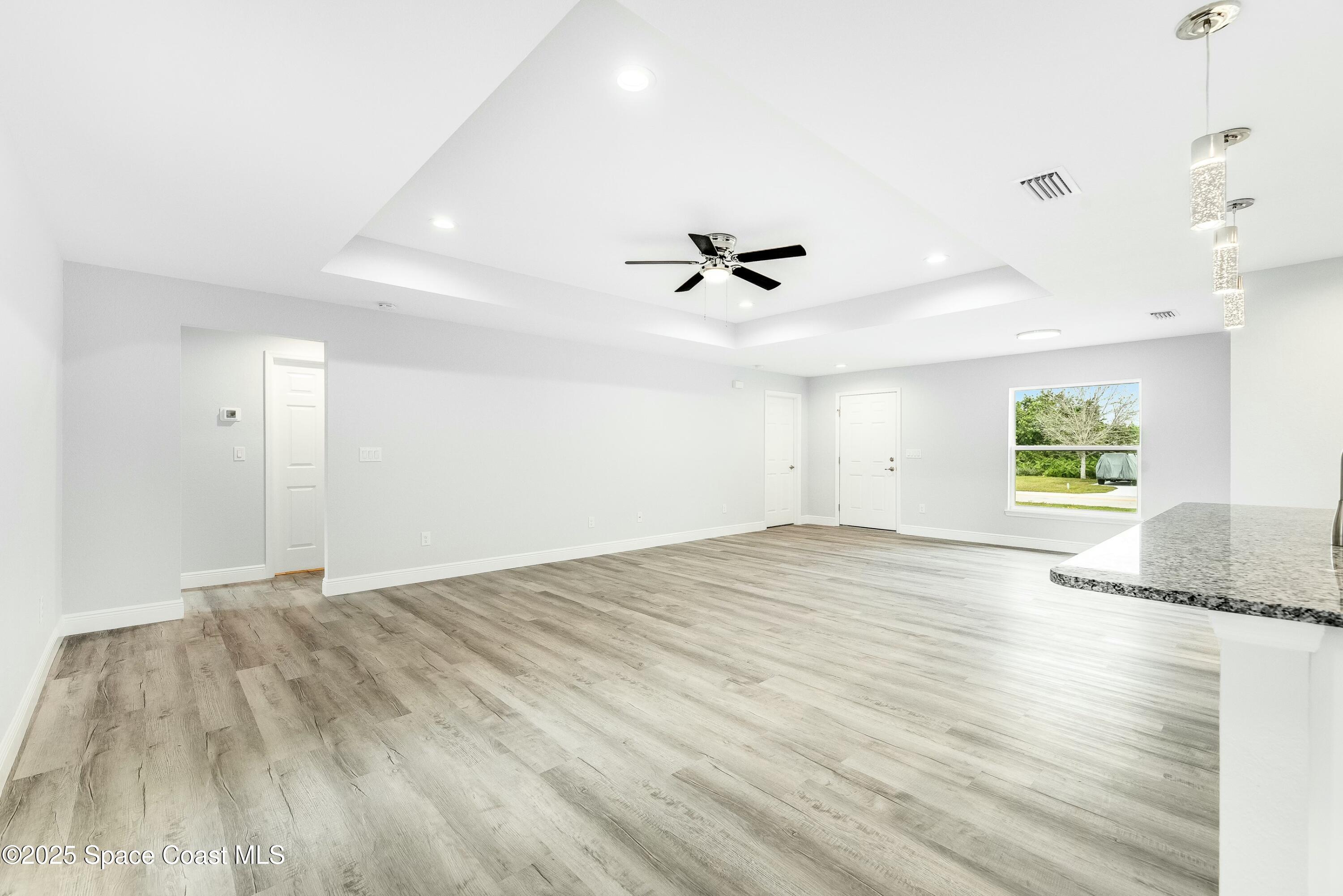 1341 Defender Street Northwest Palm Bay, FL 32907 - Photo 14 of 38 a view of an empty room and a window