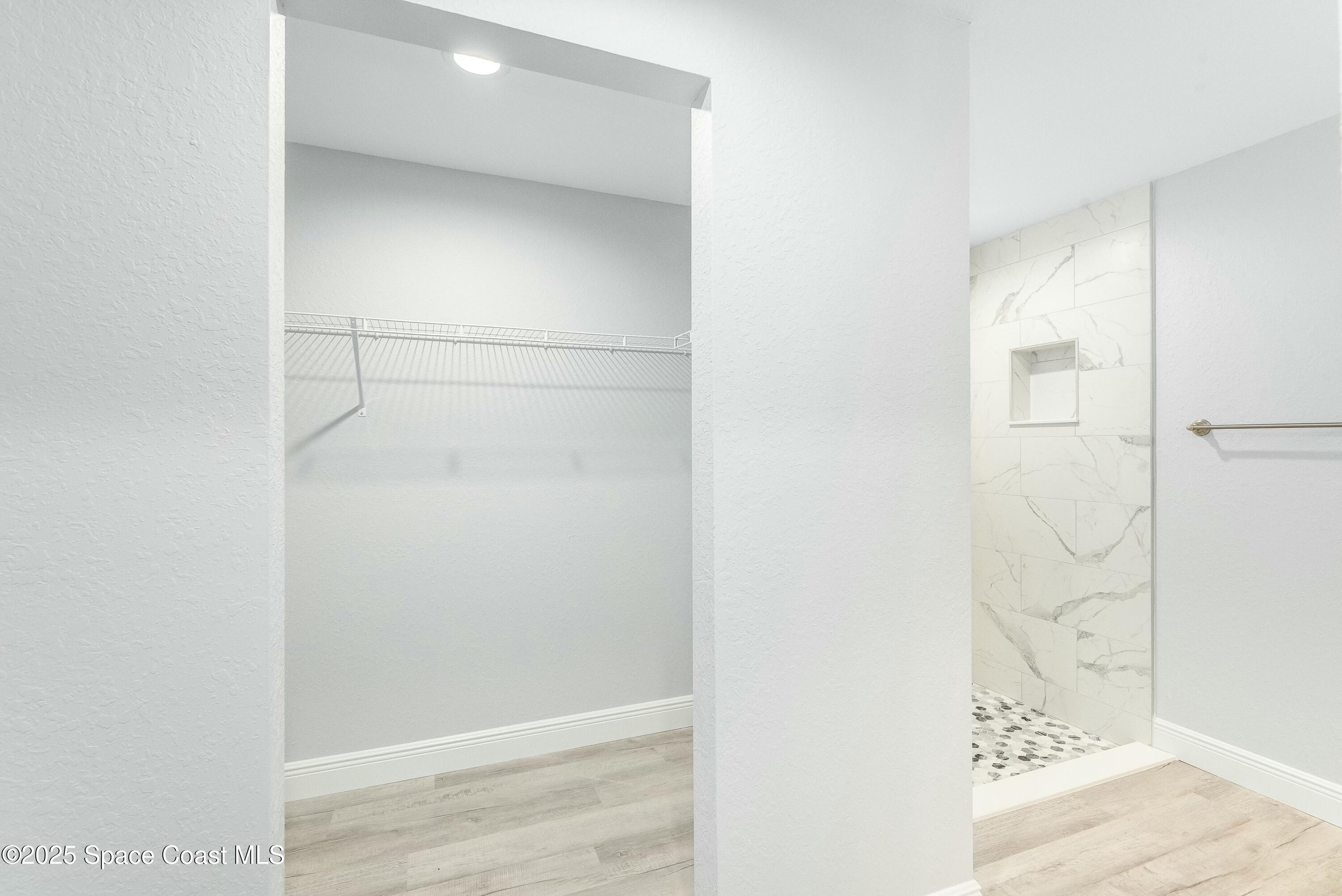 1341 Defender Street Northwest Palm Bay, FL 32907 - Photo 24 of 38 a bathroom with a shower
