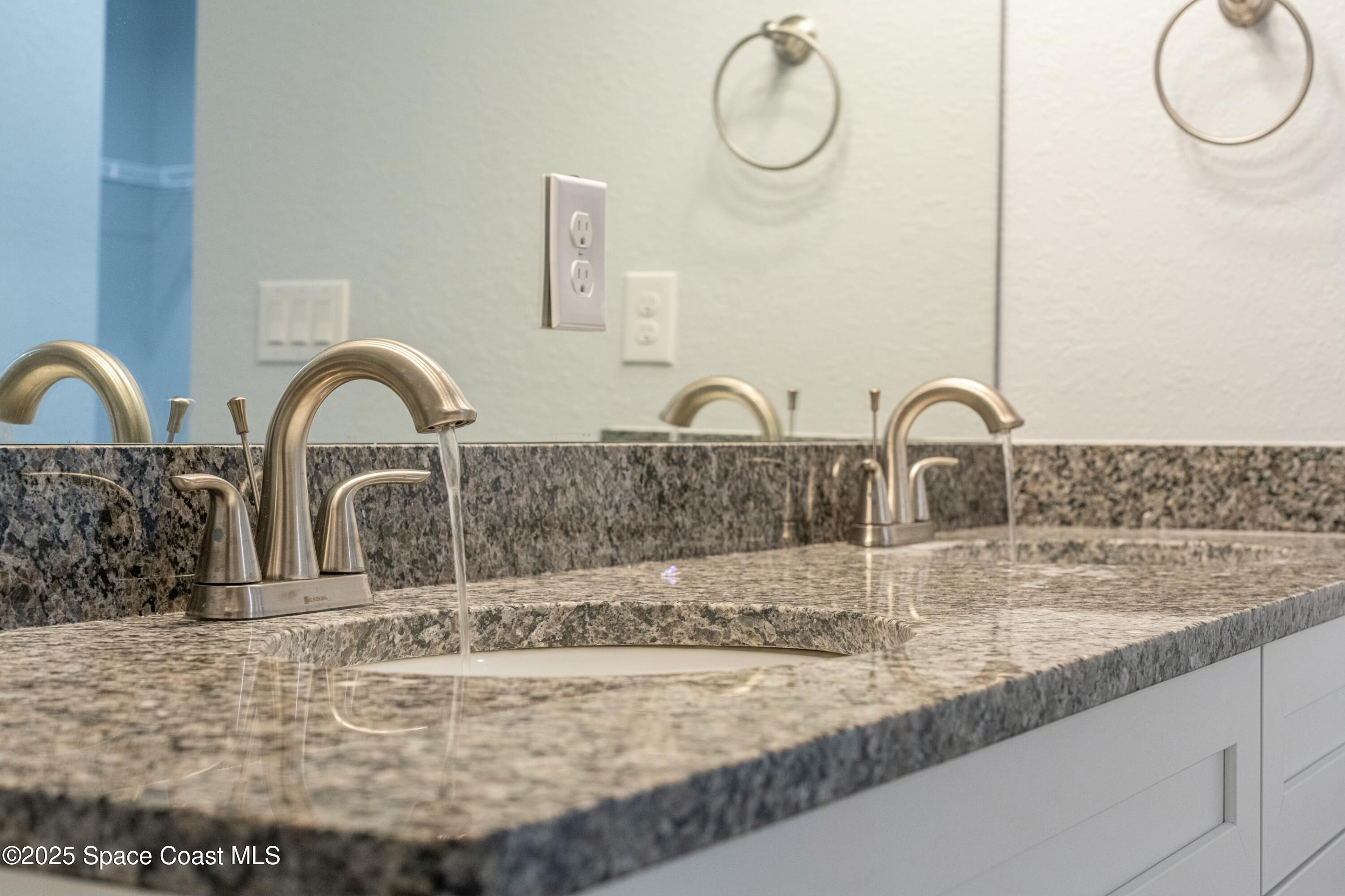 1341 Defender Street Northwest Palm Bay, FL 32907 - Photo 26 of 38 a close view of a sink and tap
