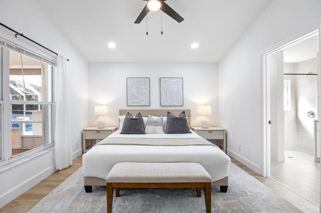 8330 Bermuda Sound Way Boynton Beach, FL 33436 - Photo 20 of 52 a bedroom with a bed and wooden floor