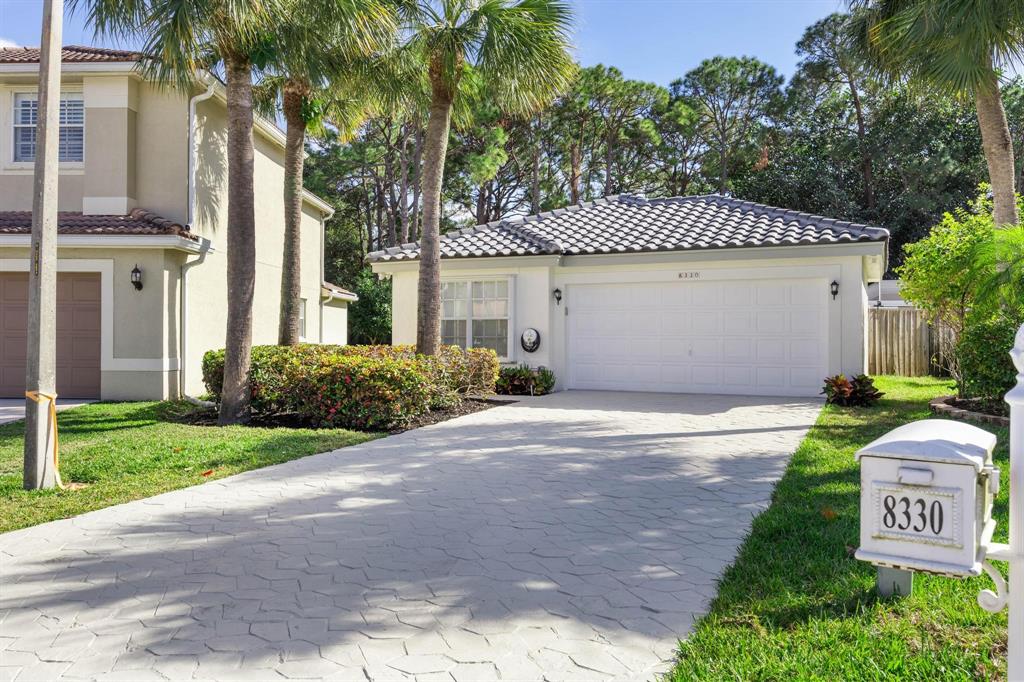 8330 Bermuda Sound Way Boynton Beach, FL 33436 - Photo 2 of 52 a front view of a house with a yard and garage