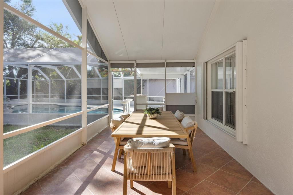 8330 Bermuda Sound Way Boynton Beach, FL 33436 - Photo 23 of 52 a dining room with furniture and a floor to ceiling window