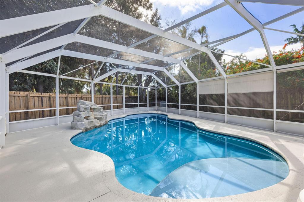 8330 Bermuda Sound Way Boynton Beach, FL 33436 - Photo 25 of 52 a view of a swimming pool with a porch