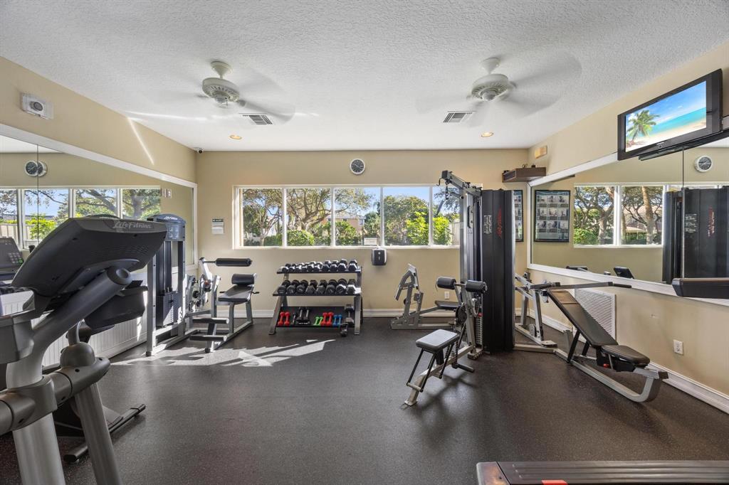 8330 Bermuda Sound Way Boynton Beach, FL 33436 - Photo 38 of 52 a room with gym equipment and a large window