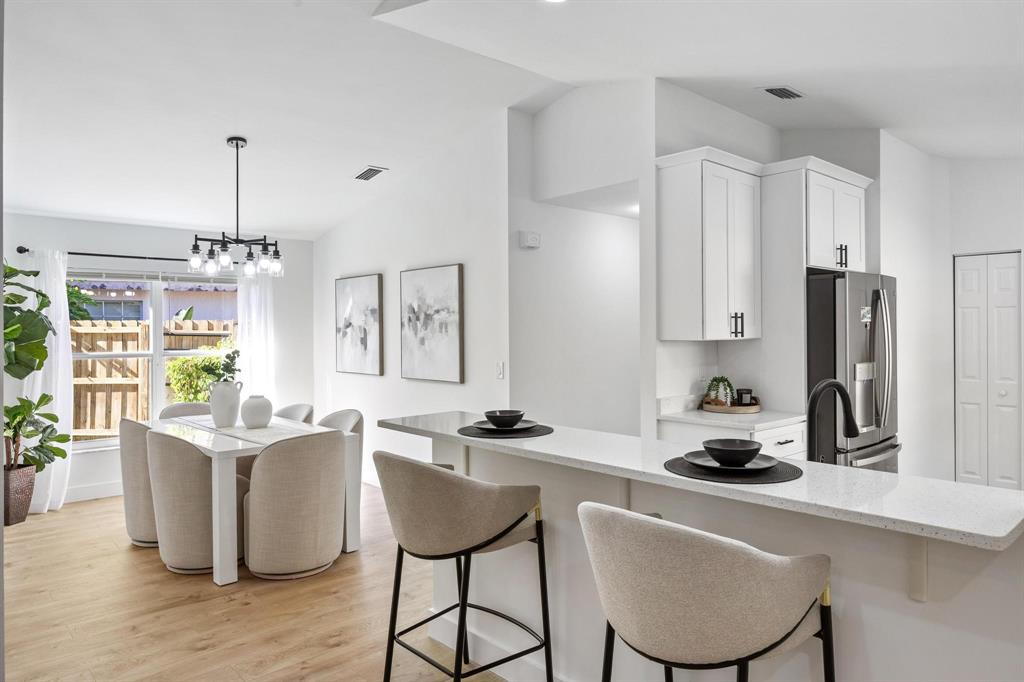 8330 Bermuda Sound Way Boynton Beach, FL 33436 - Photo 4 of 52 a kitchen with a sink refrigerator and cabinets