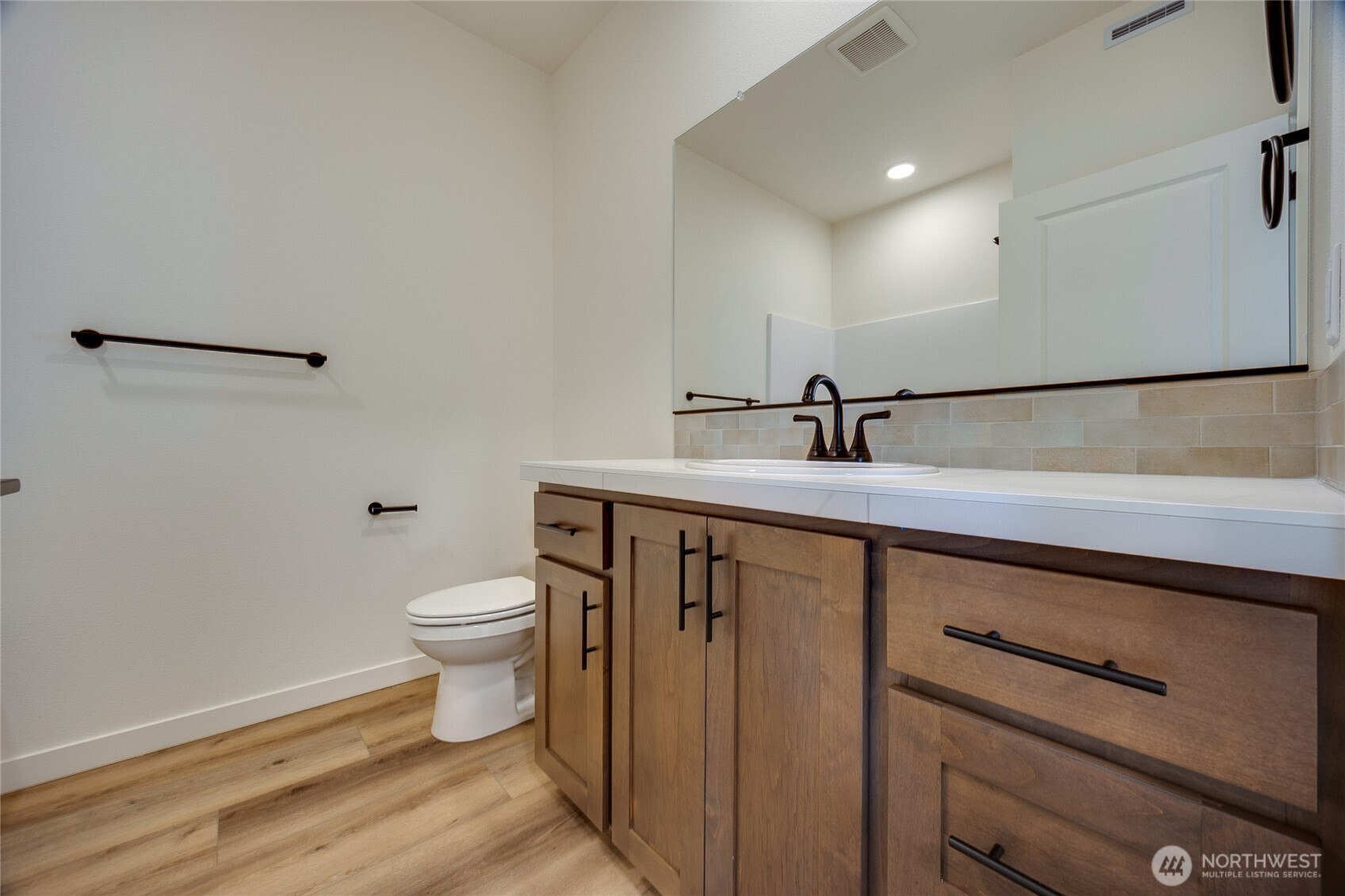 930 RW Fletcher Street Winlock, WA 98596 - Photo 14 of 40 a bathroom with a sink a toilet and mirror