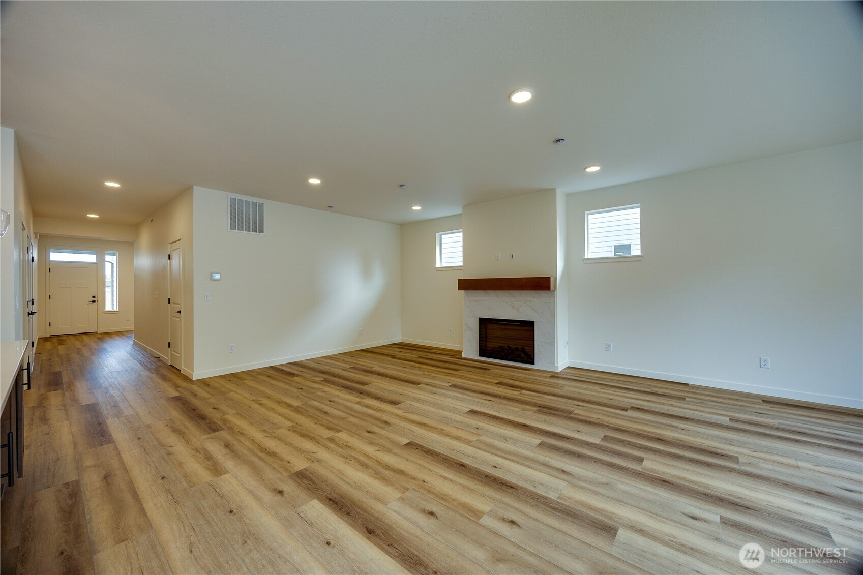930 RW Fletcher Street Winlock, WA 98596 - Photo 20 of 40 a view of empty room with wooden floor and fireplace