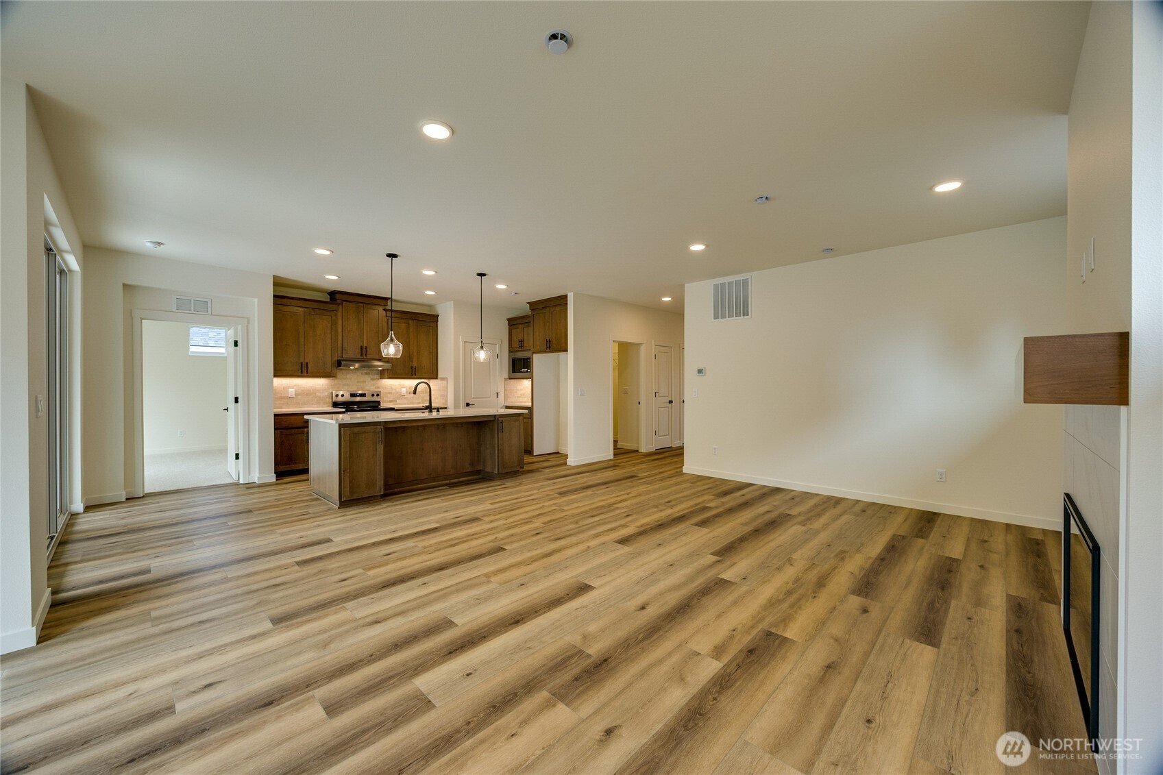 930 RW Fletcher Street Winlock, WA 98596 - Photo 21 of 40 a large kitchen with kitchen island a sink stainless steel appliances and cabinets