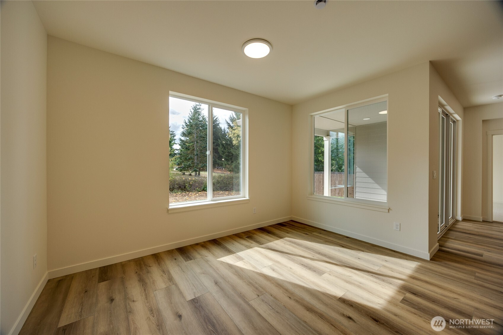930 RW Fletcher Street Winlock, WA 98596 - Photo 22 of 40 an empty room with wooden floor and windows
