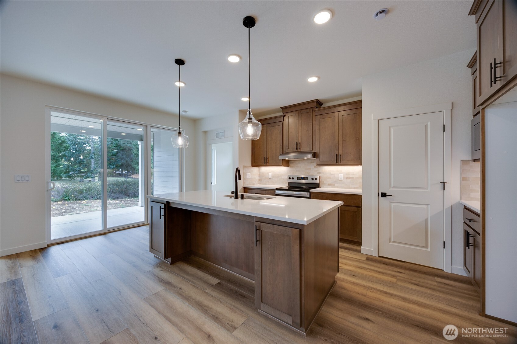 930 RW Fletcher Street Winlock, WA 98596 - Photo 26 of 40 a kitchen with kitchen island a sink appliances and cabinets