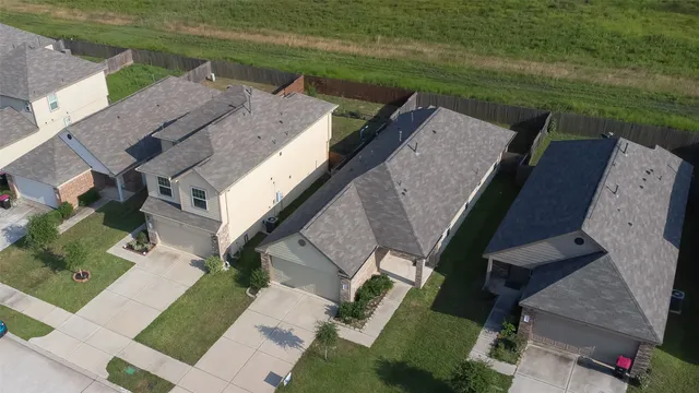 an aerial view of a house with outdoor space