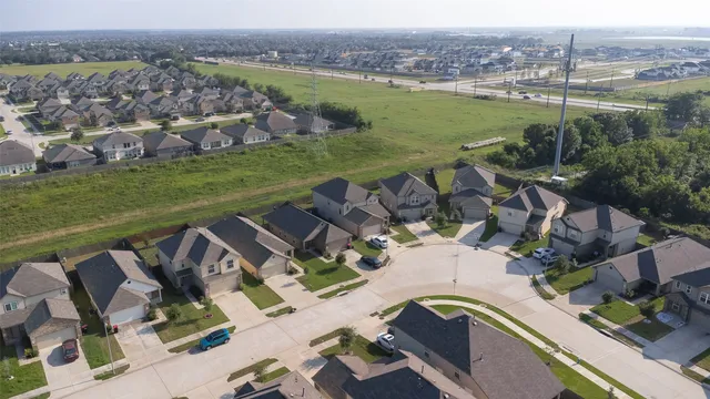 an aerial view of a house with outdoor space