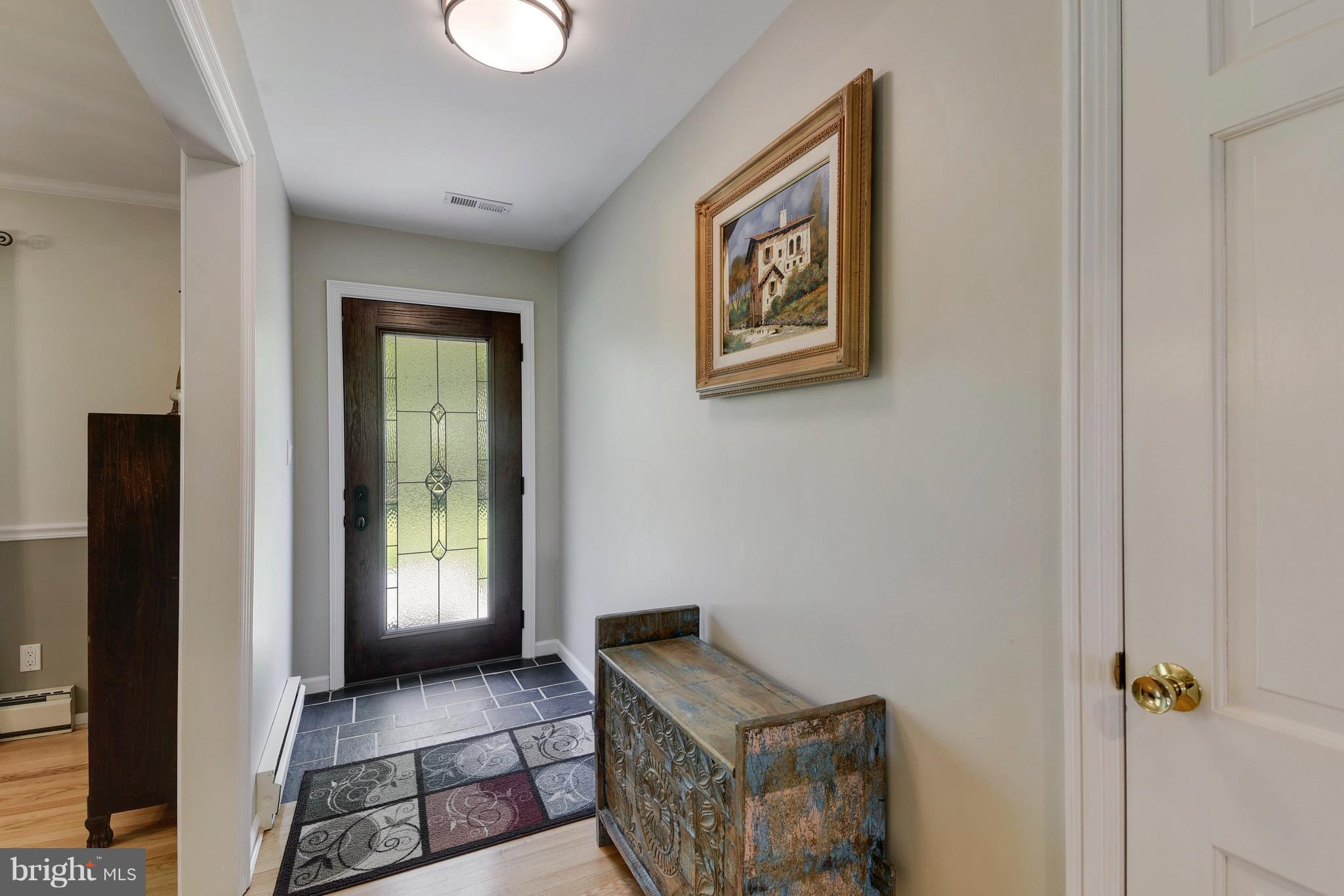 7142 Waterford Road Rixeyville, VA 22737 - Photo 3 of 25 a view of an entryway with wooden floor