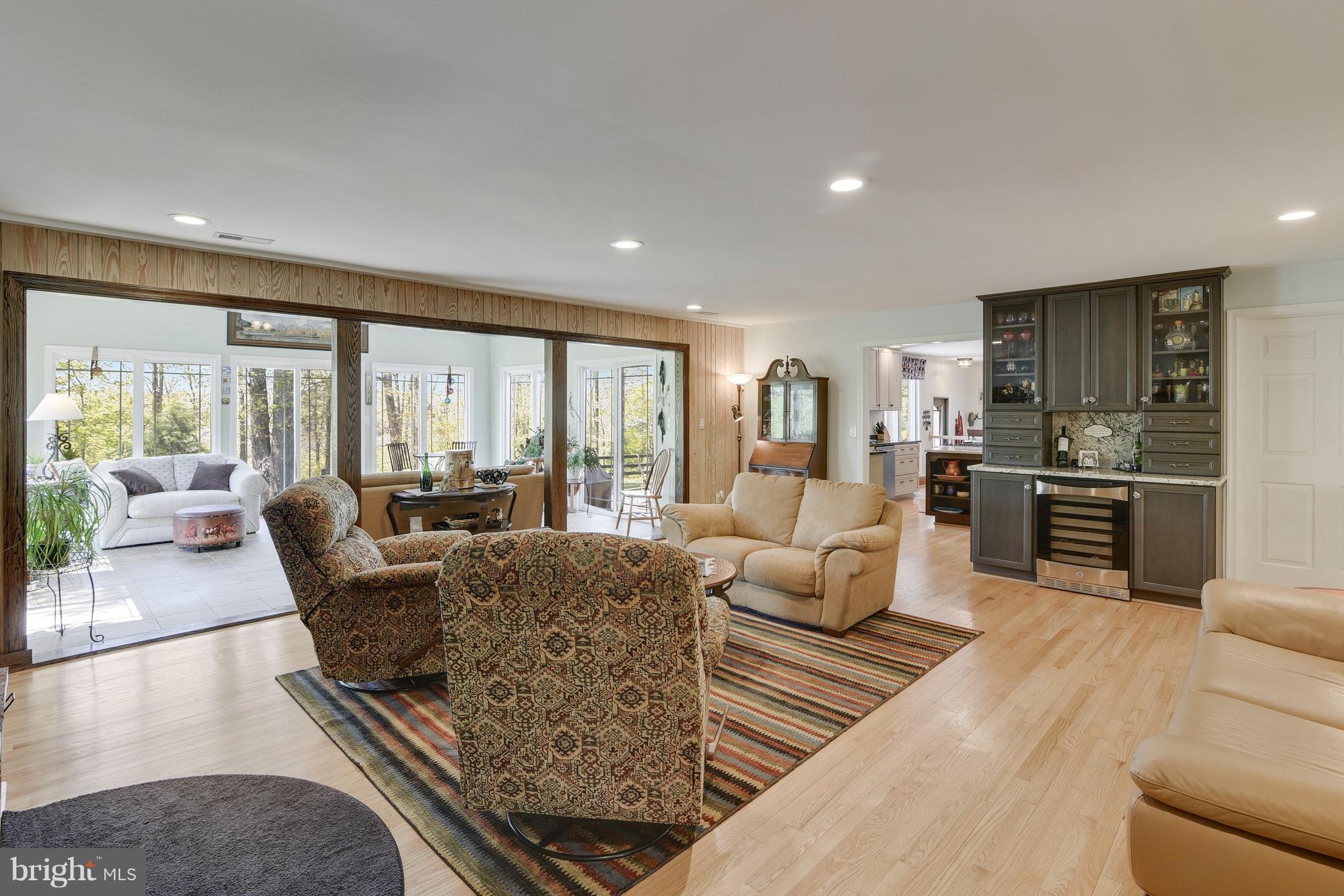 7142 Waterford Road Rixeyville, VA 22737 - Photo 8 of 25 a living room with furniture wooden floor and a large window