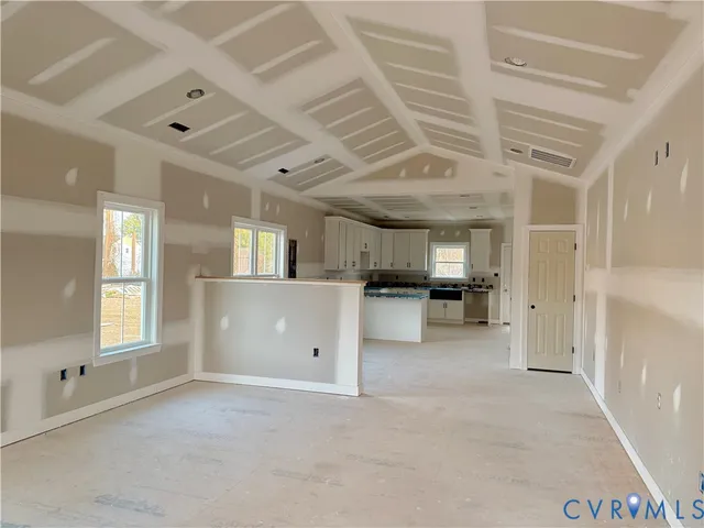 a view of a kitchen with furniture and a window