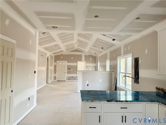 a large kitchen with granite countertop lots of counter top space