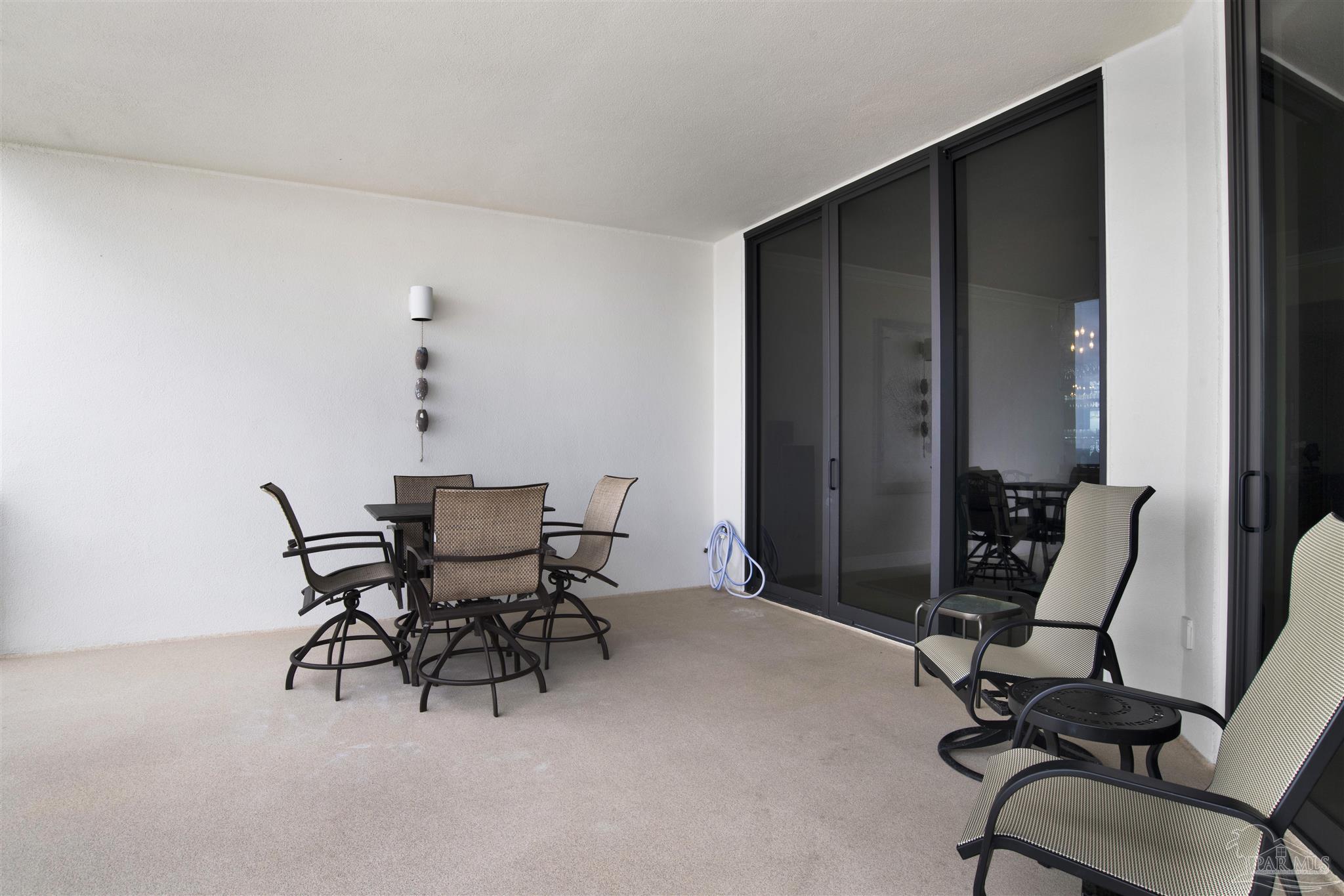 16547 Perdido Key Drive, Unit E501 Pensacola, FL 32507 - Photo 17 of 63 a view of a workspace with furniture and lounge chair