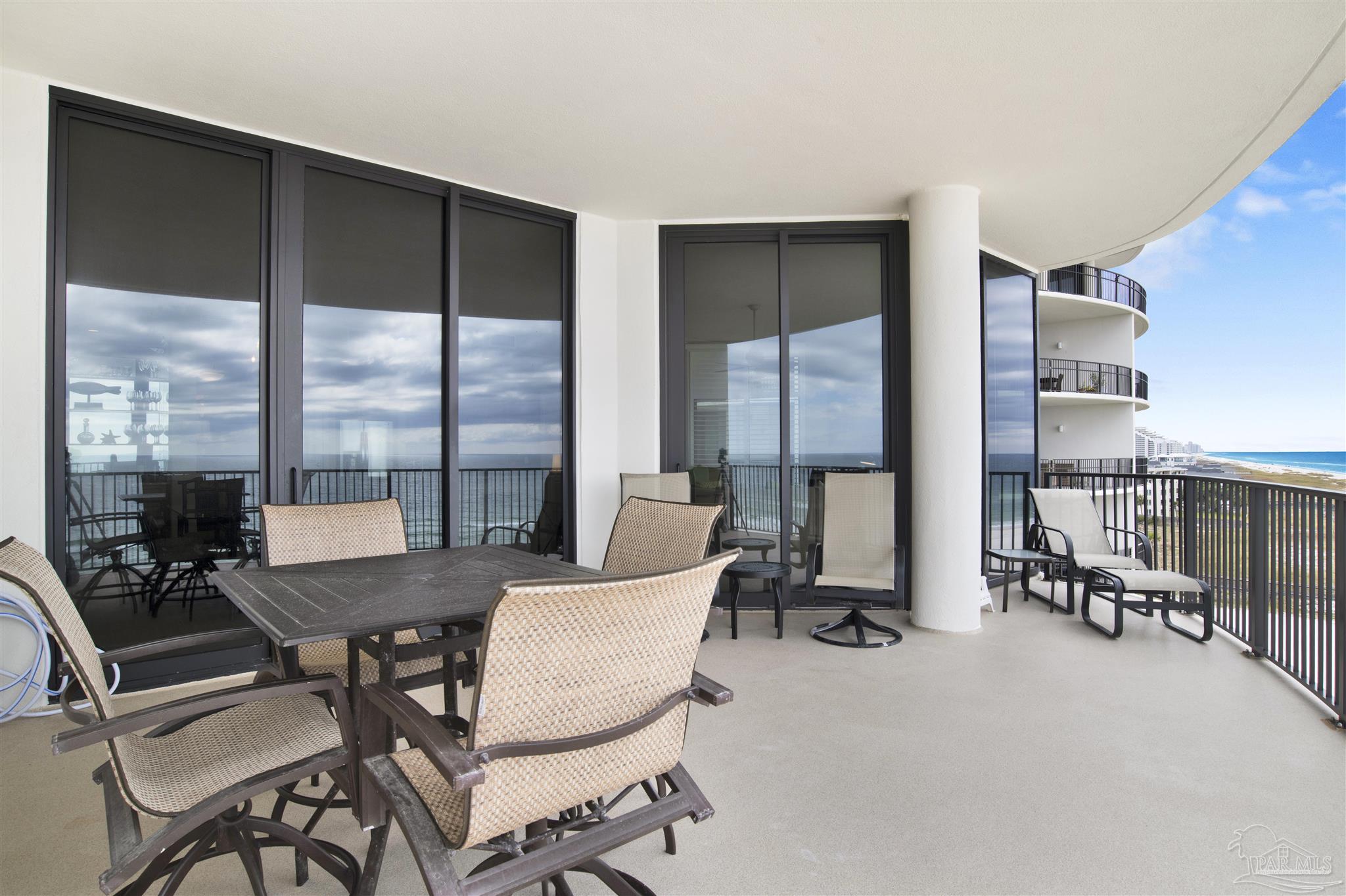 16547 Perdido Key Drive, Unit E501 Pensacola, FL 32507 - Photo 18 of 63 a view of a workspace with furniture and floor to ceiling window