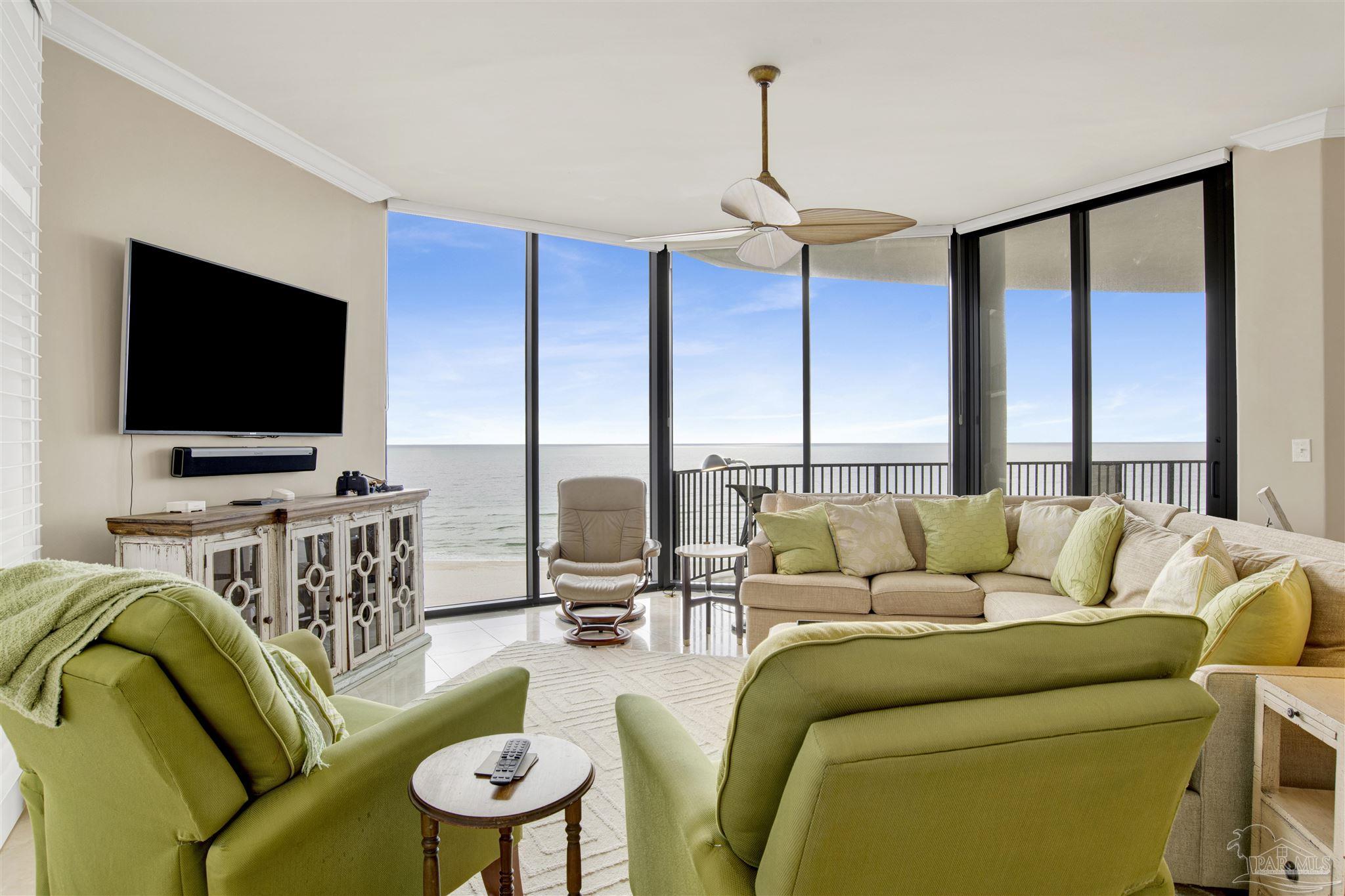 16547 Perdido Key Drive, Unit E501 Pensacola, FL 32507 - Photo 2 of 63 a living room with furniture and a flat screen tv
