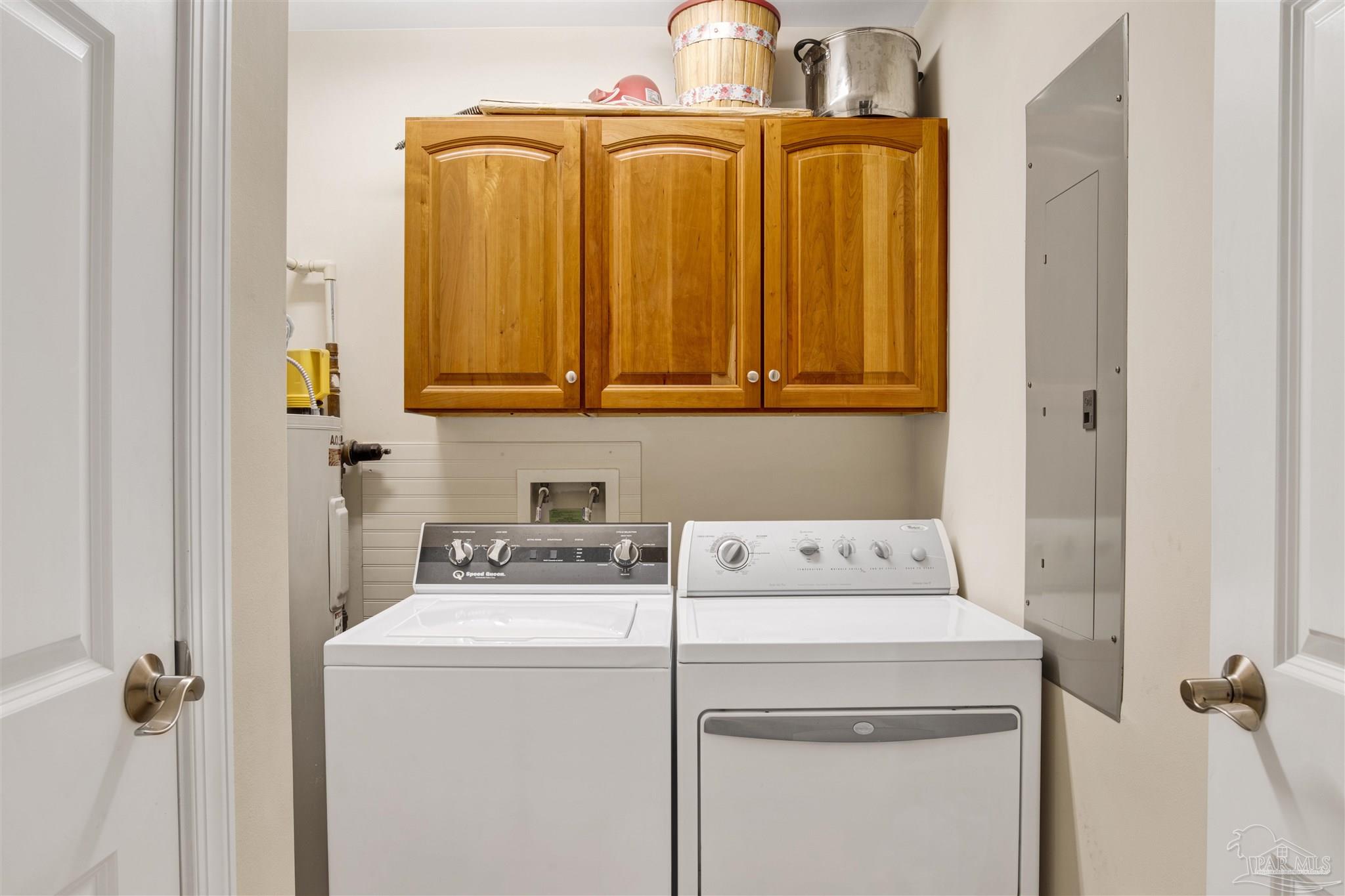16547 Perdido Key Drive, Unit E501 Pensacola, FL 32507 - Photo 24 of 63 a utility room with dryer and washer