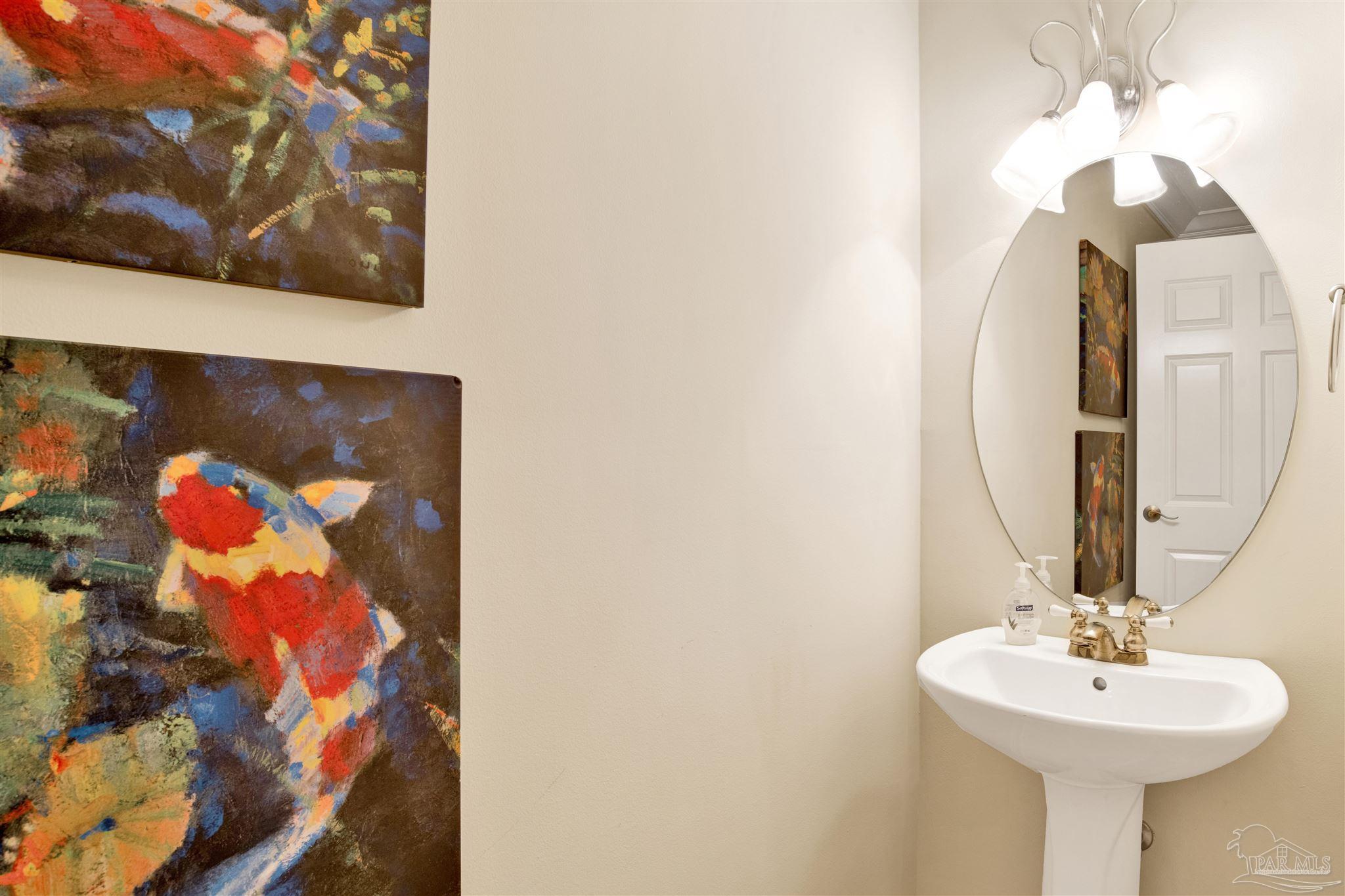 16547 Perdido Key Drive, Unit E501 Pensacola, FL 32507 - Photo 25 of 63 a bathroom with a sink and a mirror