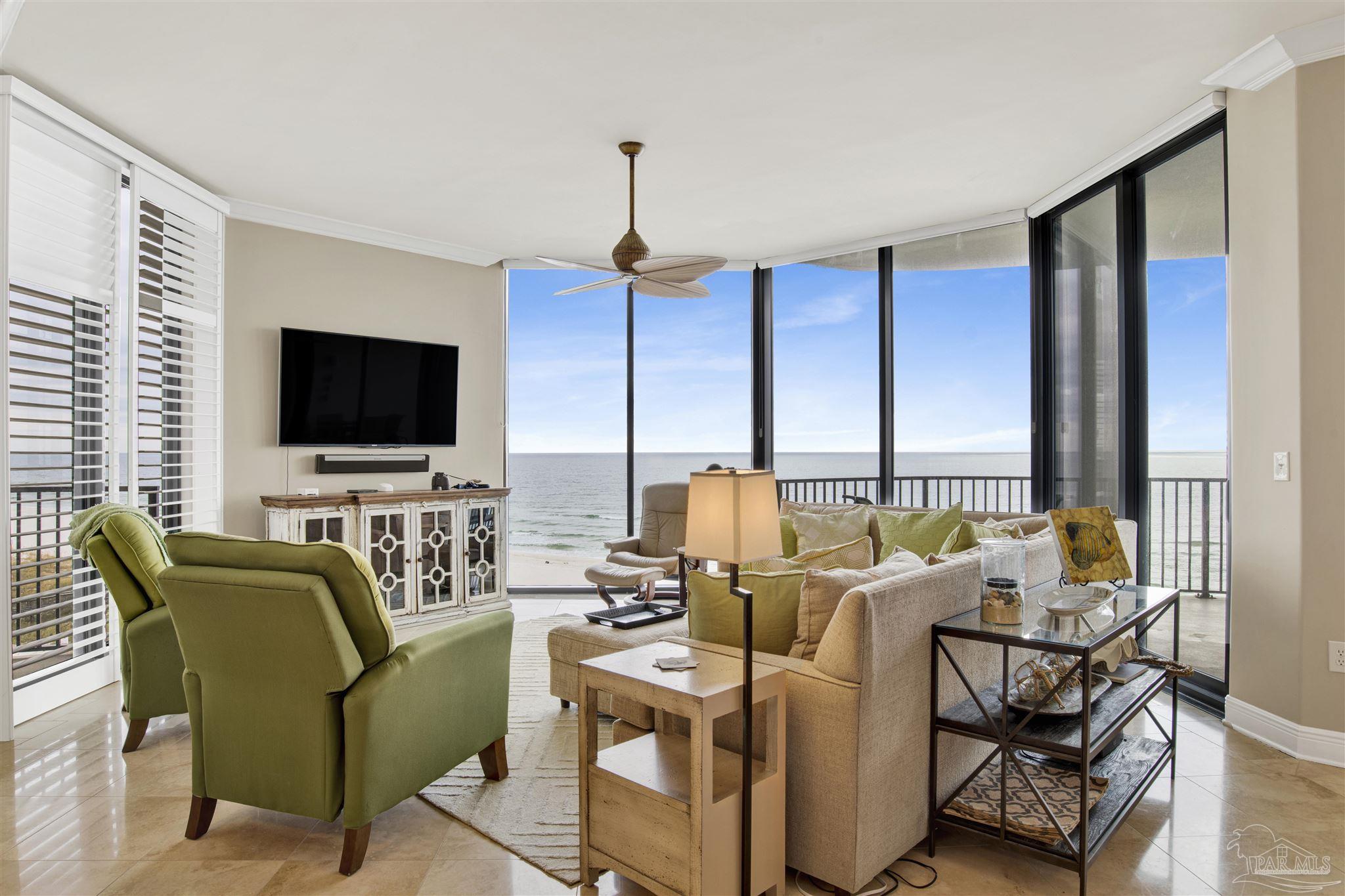 16547 Perdido Key Drive, Unit E501 Pensacola, FL 32507 - Photo 3 of 63 a view of a livingroom with furniture and a flat screen tv