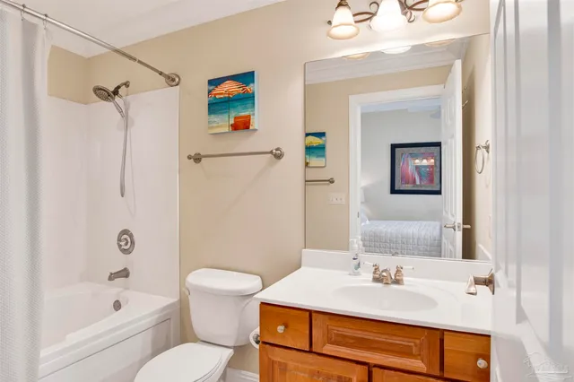 a living room with furniture pool table and a flat screen tv
