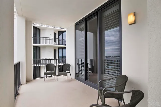 a view of a living room and balcony