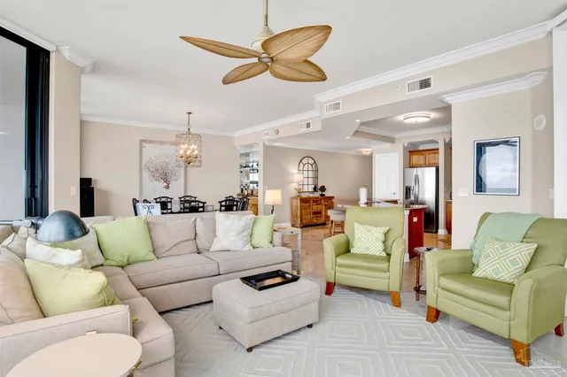 a living room with furniture a flat screen tv and a large window