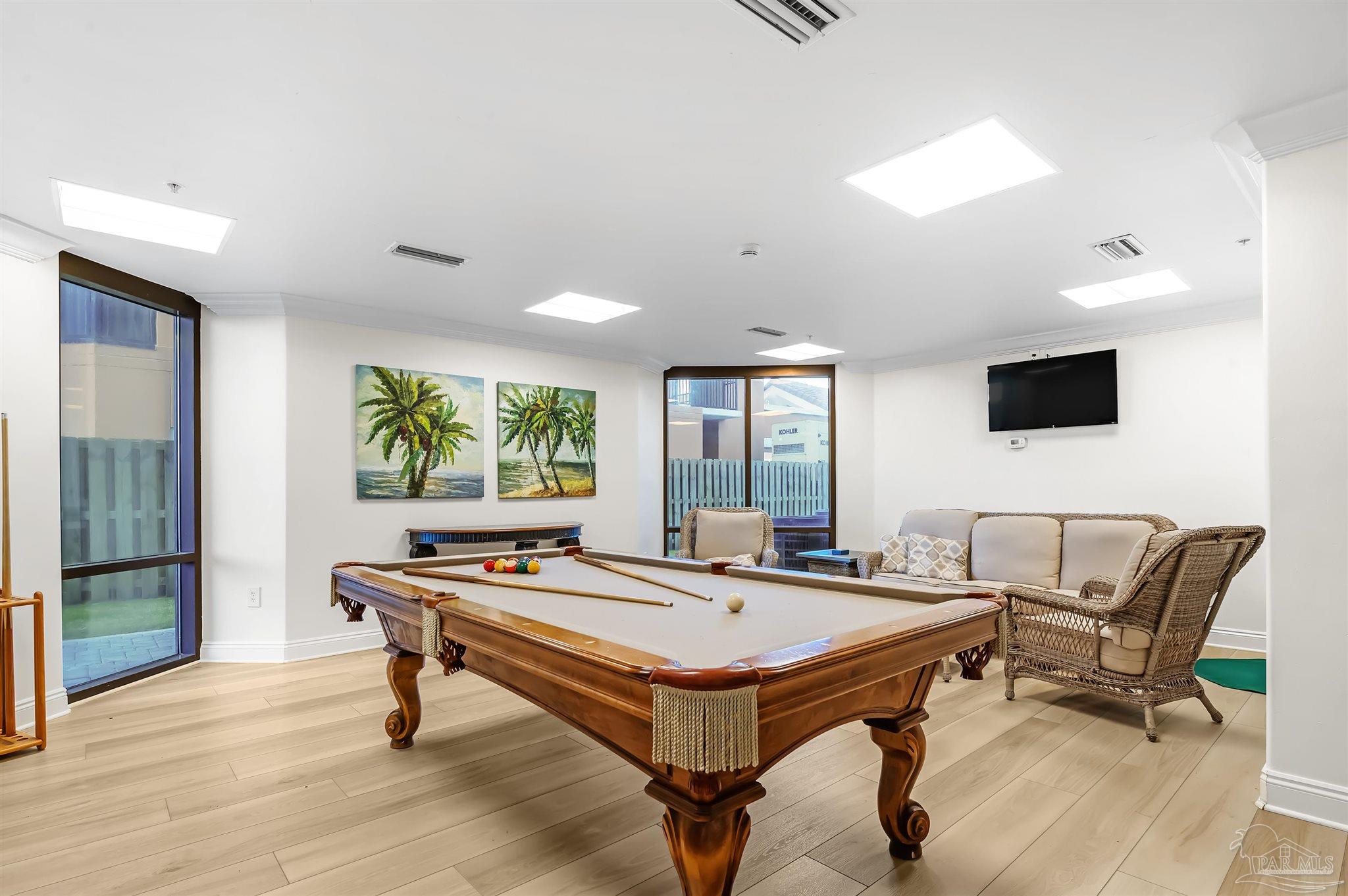 16547 Perdido Key Drive, Unit E501 Pensacola, FL 32507 - Photo 43 of 63 a living room with furniture pool table and a flat screen tv