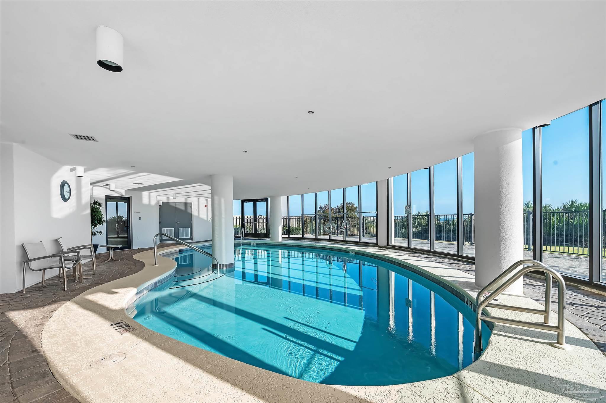 16547 Perdido Key Drive, Unit E501 Pensacola, FL 32507 - Photo 44 of 63 a view of a living room and a kitchen