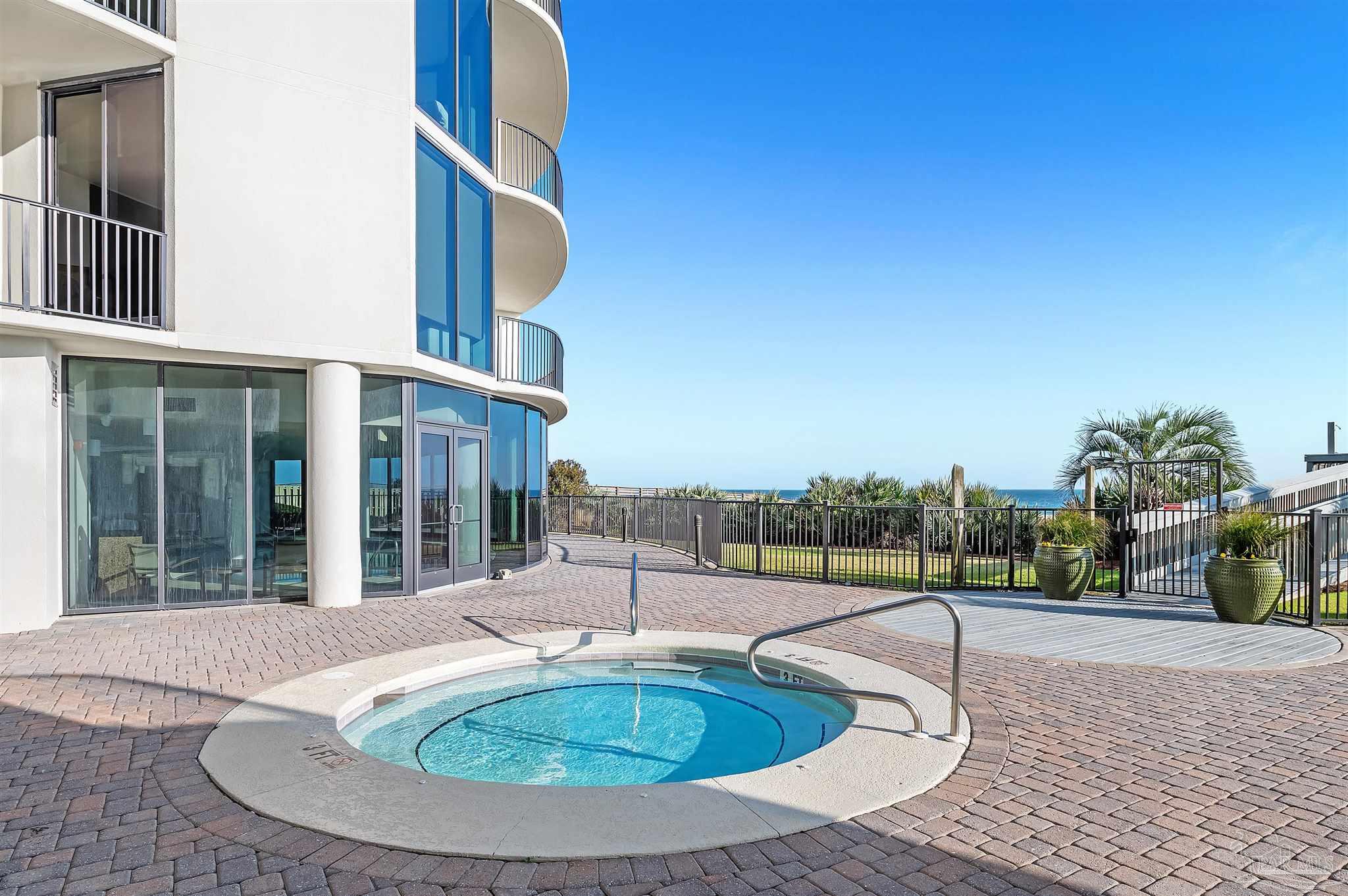 16547 Perdido Key Drive, Unit E501 Pensacola, FL 32507 - Photo 52 of 63 a view of a house with a swimming pool