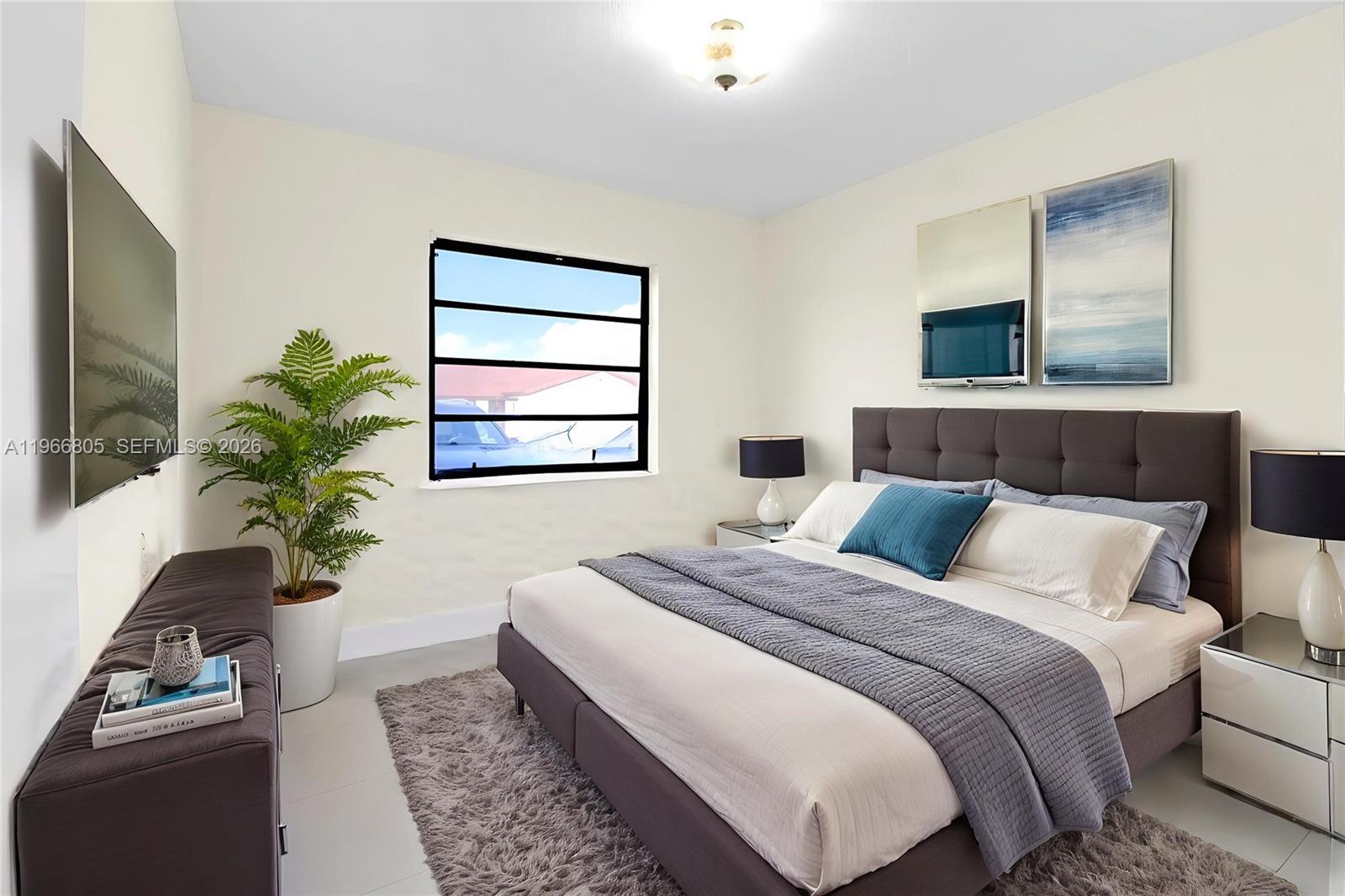 13844 Southwest 15th Street Miami, FL 33184 - Photo 12 of 31 a bedroom with bed and a couch