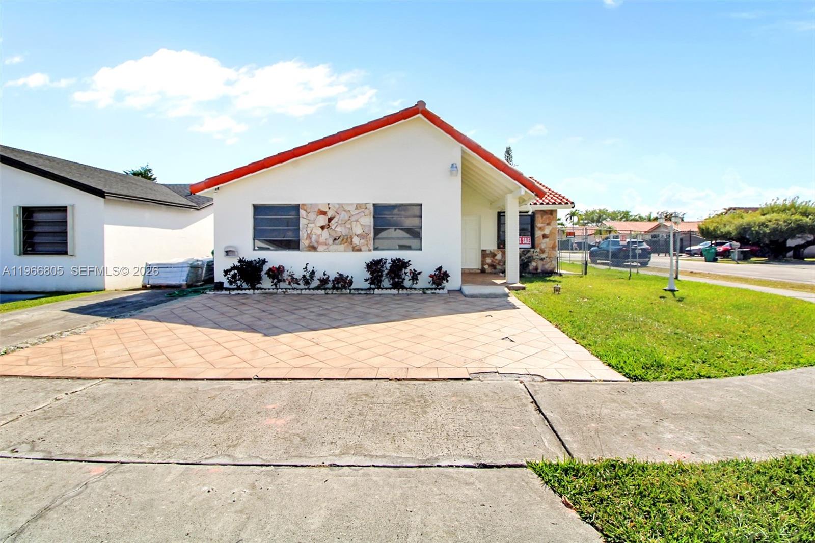 13844 Southwest 15th Street Miami, FL 33184 - Photo 18 of 31 a backyard of a house with yard and garage