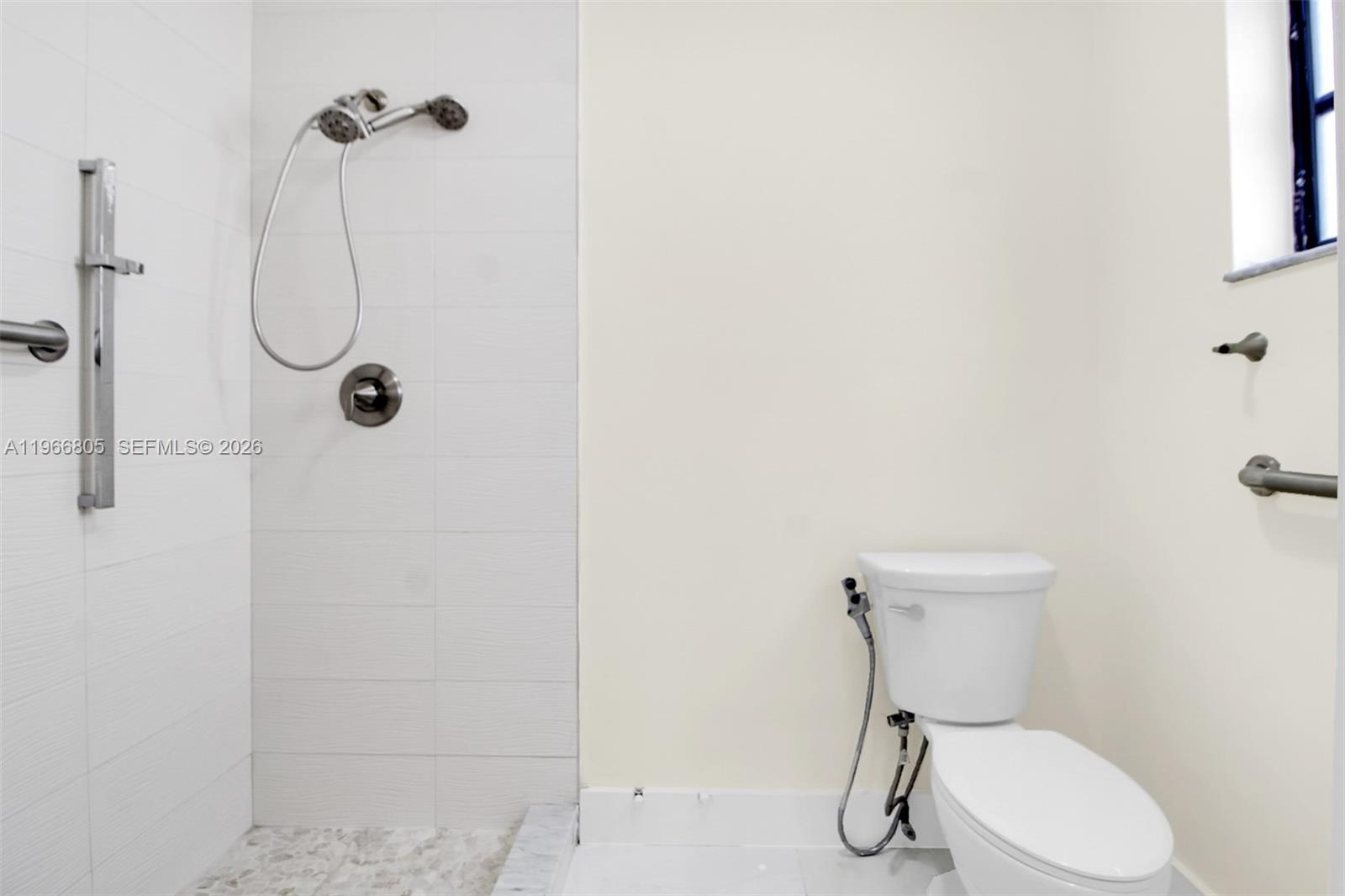 13844 Southwest 15th Street Miami, FL 33184 - Photo 24 of 31 a bathroom with a toilet shower