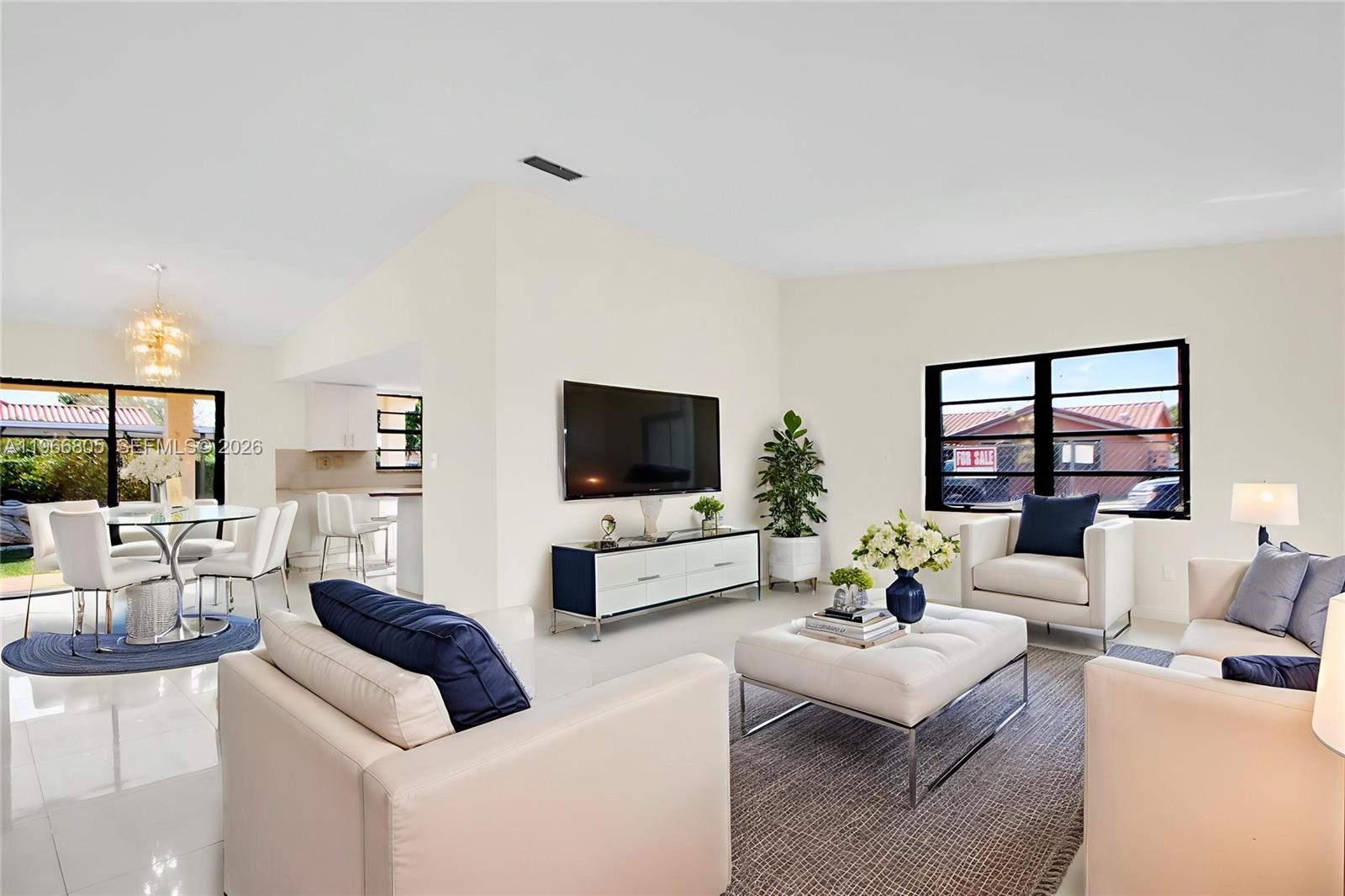 13844 Southwest 15th Street Miami, FL 33184 - Photo 4 of 31 a living room with furniture and a flat screen tv