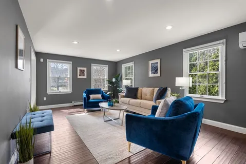 a living room with furniture and windows