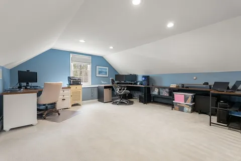a room with furniture and a flat screen tv
